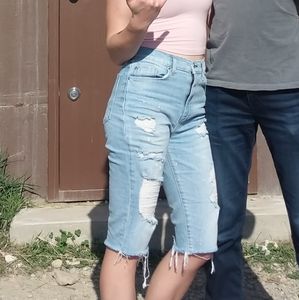 knee length distressed light wash shorts